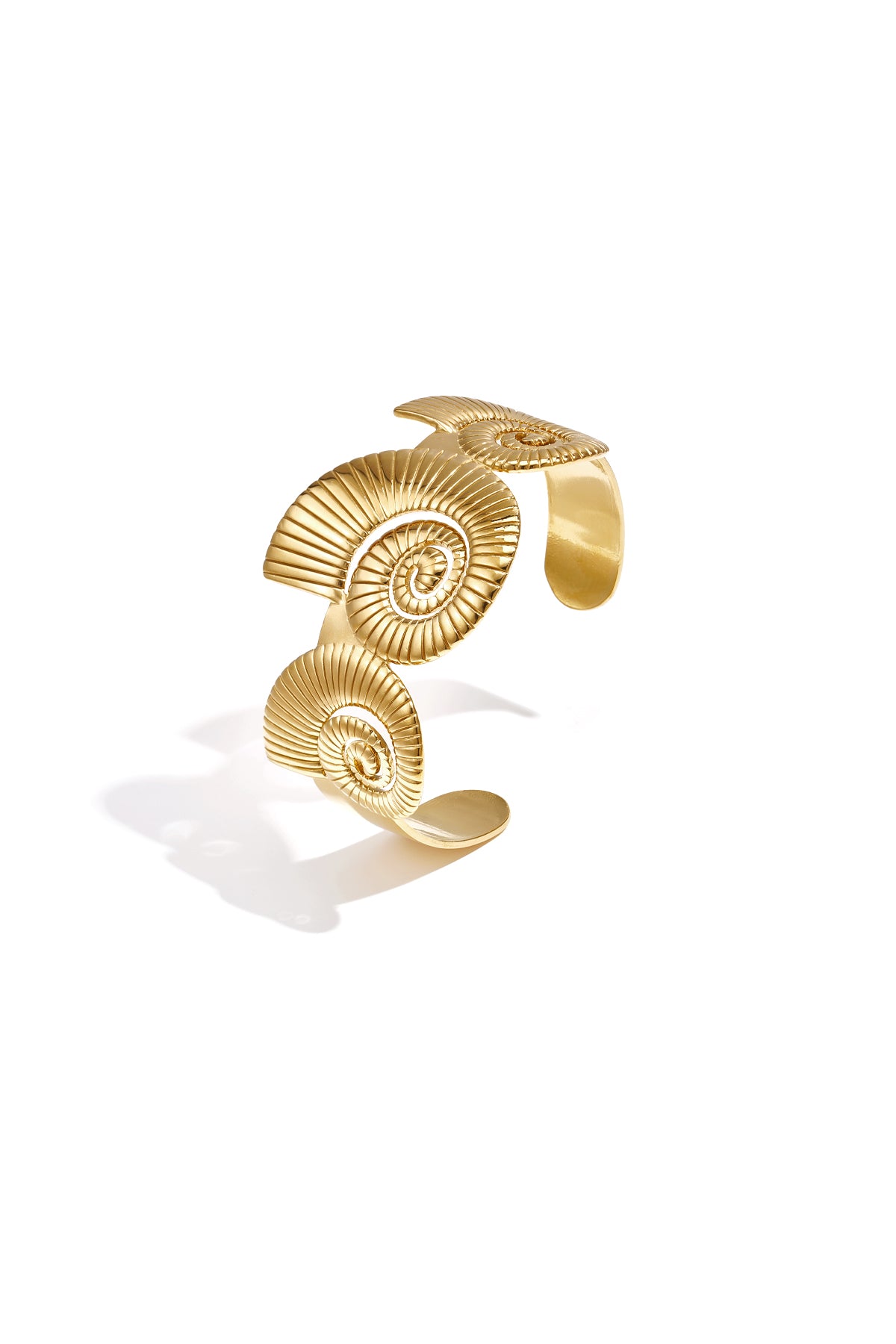 Cuff statement bracelet with spiral shells